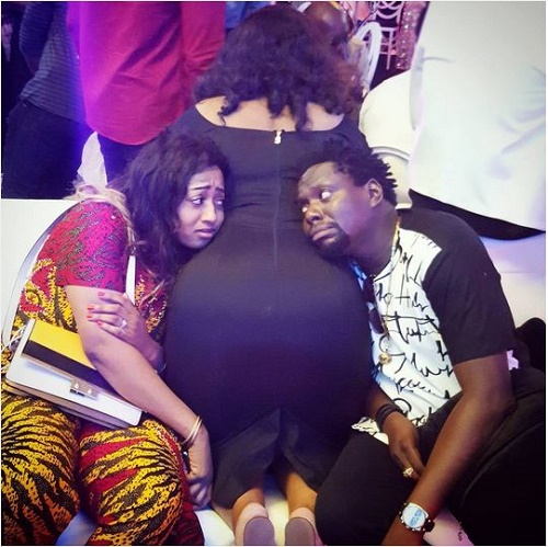 Comedian Klint Da Drunk and Wife Pose on a Lady's Massive Butt (Photo)