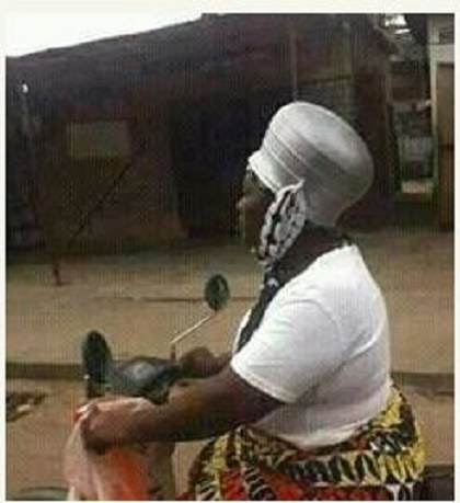 Hilarious: Female Motorcyclist Wears Cooking Pot on Her Head as Helmet ...