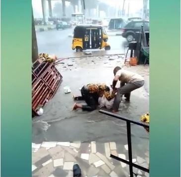 SMH! Two Men Fight Dirty Under The Rain Because Of A Lady (Photos & Video) %Post Title