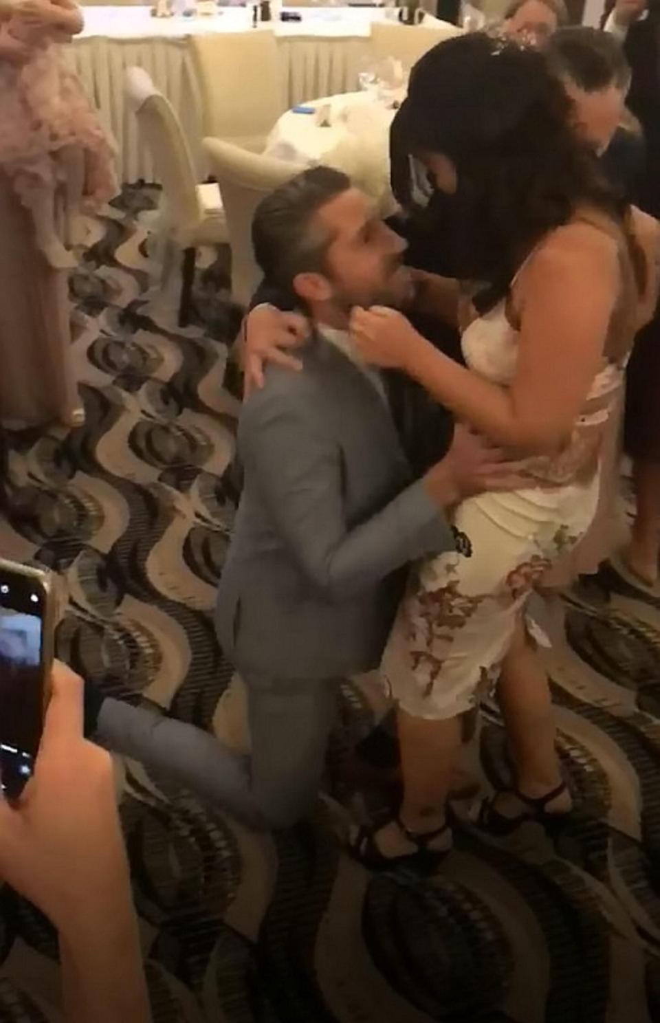 Bride's Bouquet Throw Leads To Instant Surprise Proposal For Shocked Wedding Guest