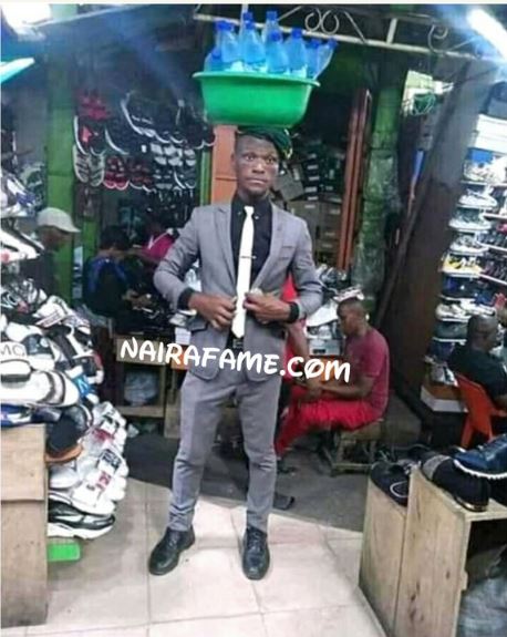 Man Hawking Bottle Water In Suit Spotted In Lagos Market 