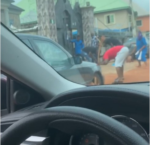 Church members flogging the devil