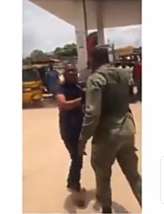 The soldier dragging the police officer during the altercation
