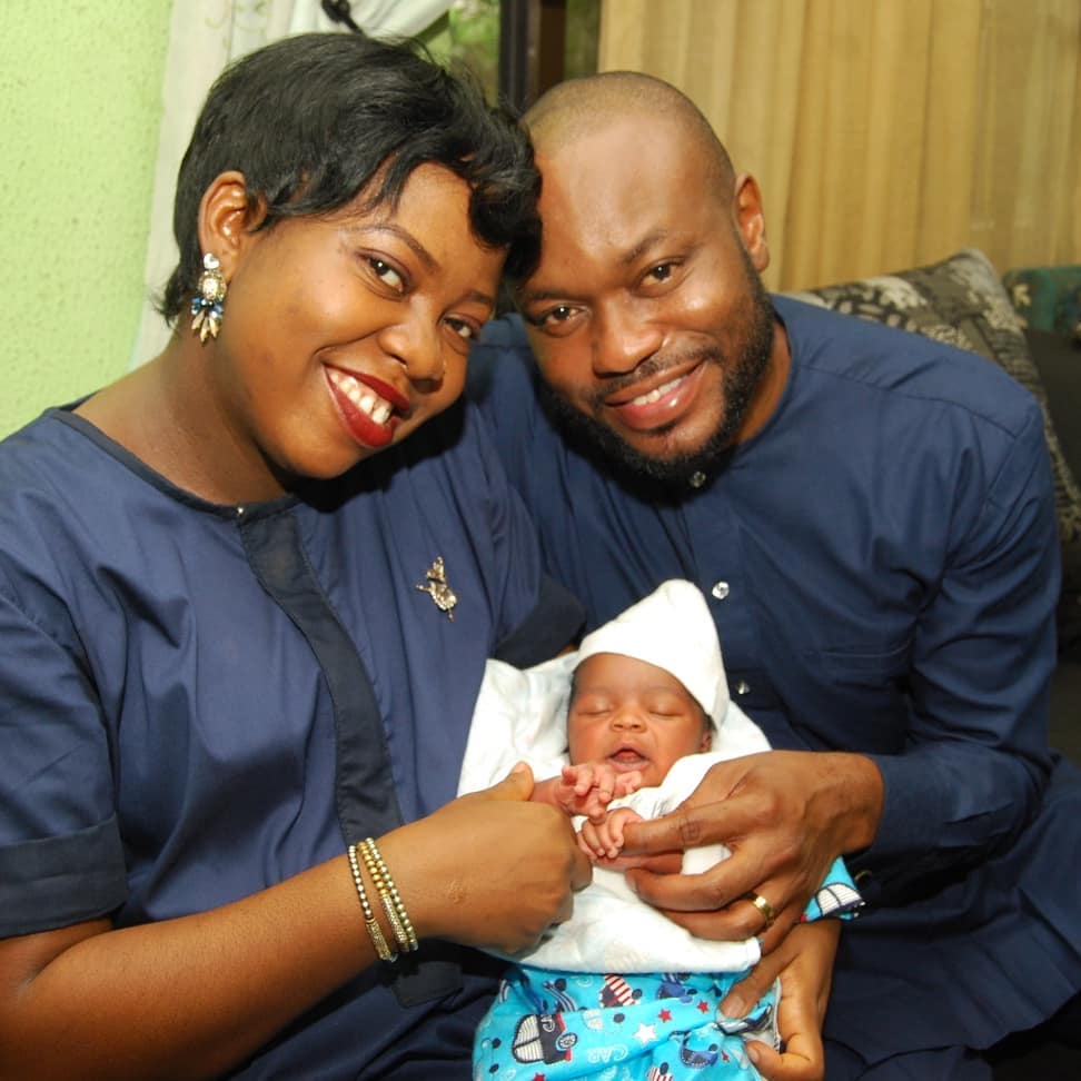Okot and husband with their baby