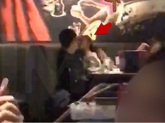 Ariana Grande kissing a mystery man