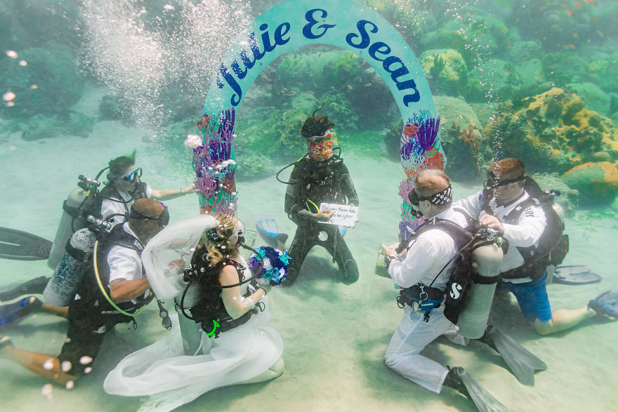 Julie and husband Sean tie the knot underwater