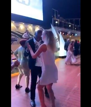 Ayodele Fayose dancing with a white woman abroad
