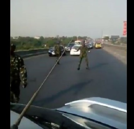 Photo of the cadets blocking motorists on the road