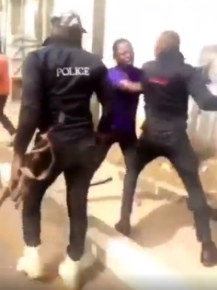 Man being beaten by Nigerian Police