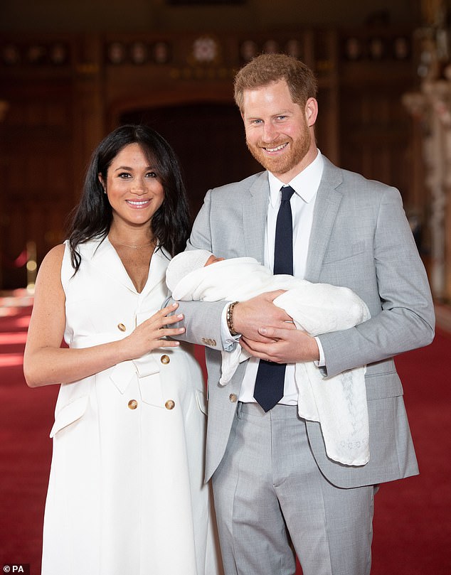 Prince Harry and wife, Meghan Markle alongside their son, Archie