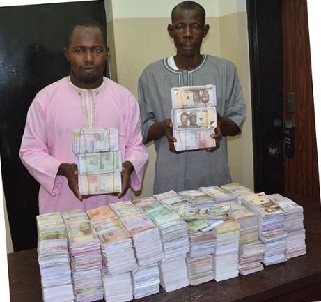 The arrested fraudsters with the fake notes