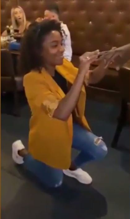 Woman kneels to propose to her boyfriend