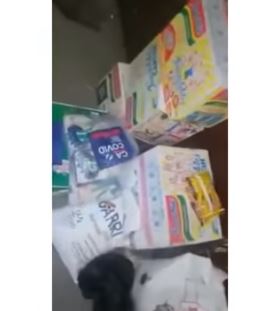 The woman shows off what she got from Covid-19 warehouse