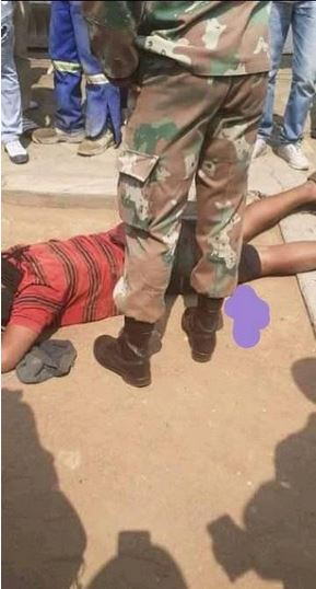 soldier shoots man