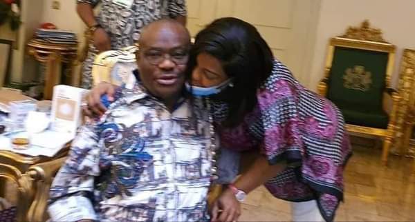 Governor Nyesom Wike gets a peck from his wife after Edo election victory