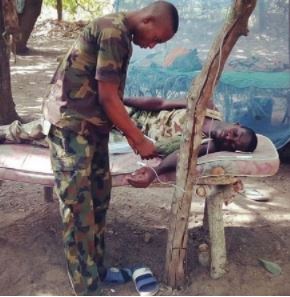 Touching photo of the Nigerian soldier receiving treatment 