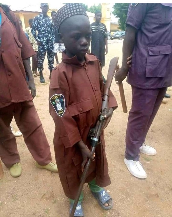 10-year-old vigilante member carrying gun