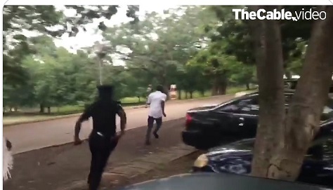 Police officer chasing IPOB supporter