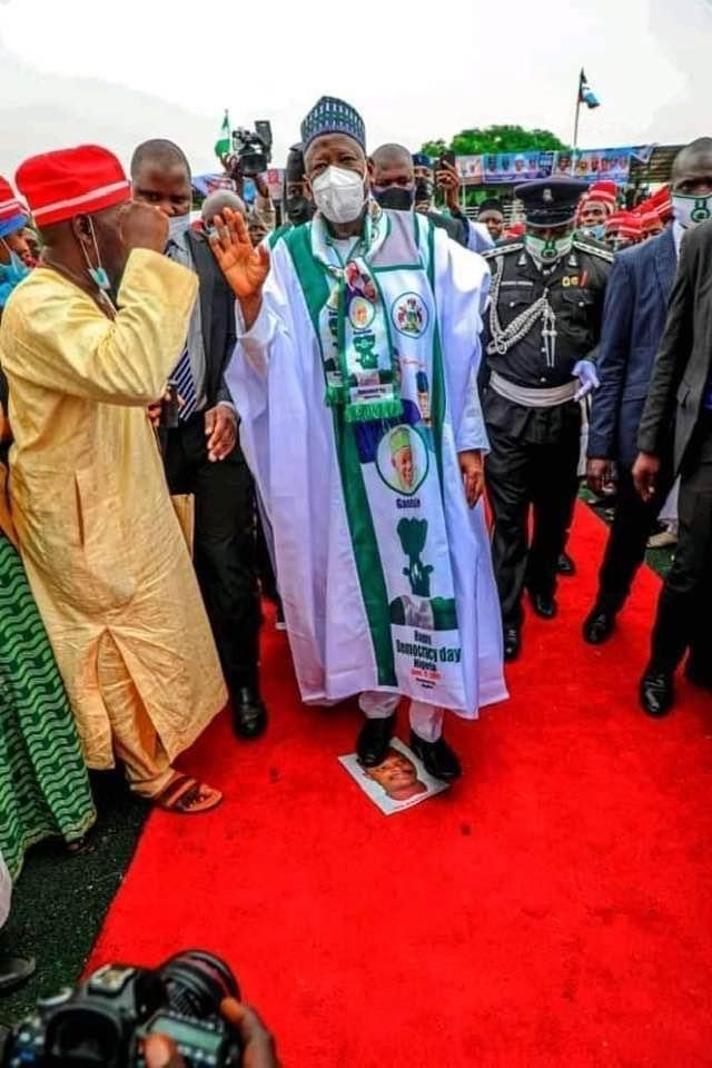 Ganduje steps on Rabiu Musa Kwankwaso's picture during rally