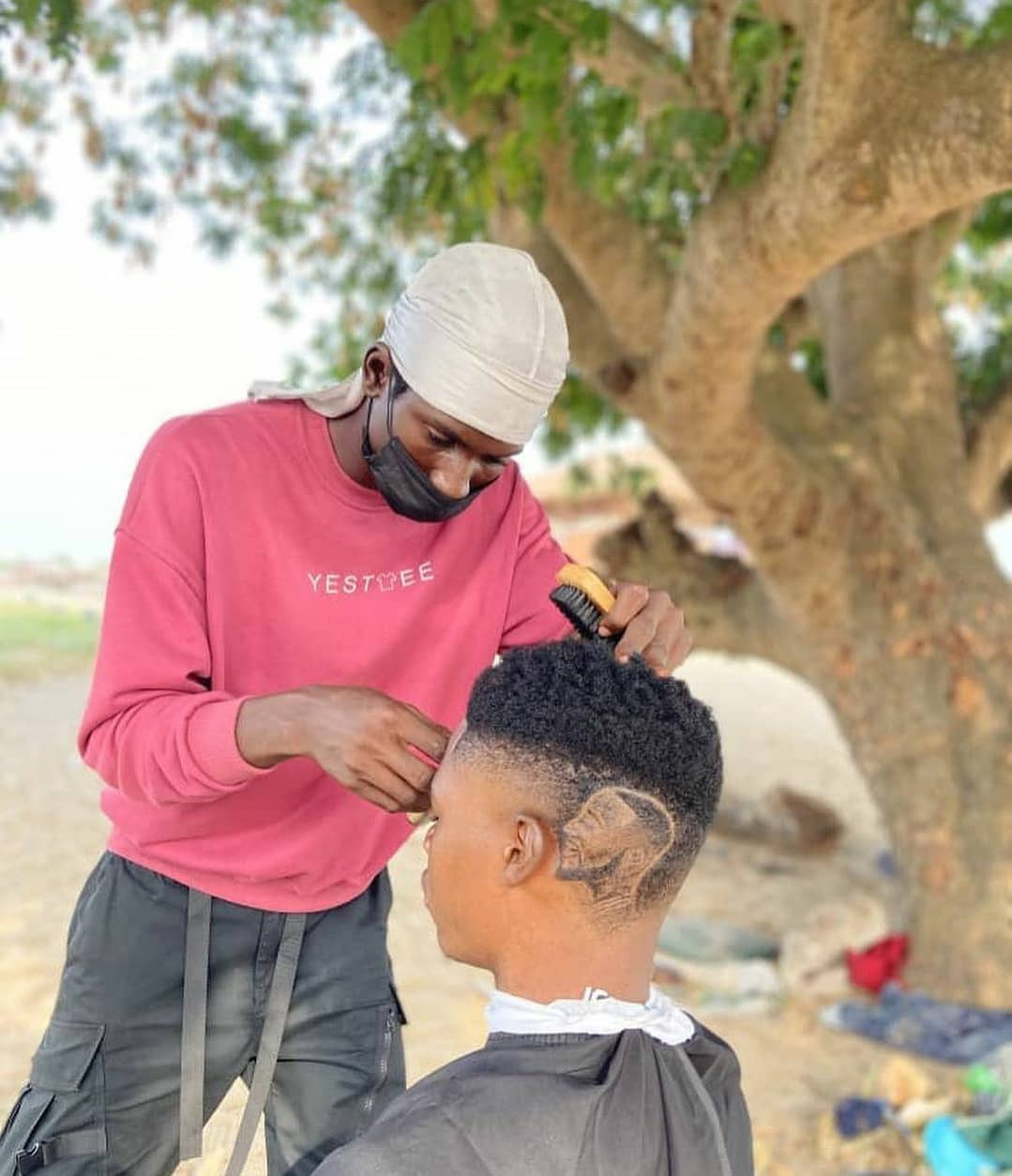 Davido's fan carves him on his hair