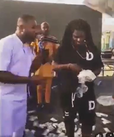 Gozie singing for a herbalist