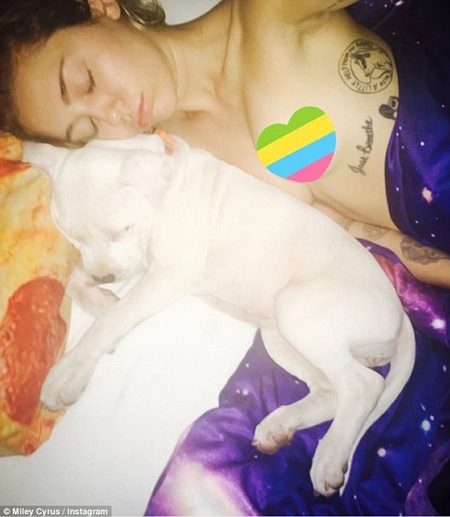 Miley Cyrus Shares Another Topless Selfie as She Cuddles Her New Dog