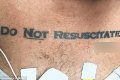 Hospital Thrown Into Panic After An Unconscious Man Was Found With Weird Tattoo On His Chest (Photo)