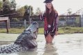 Unbelievable: University Student Celebrates Her Graduation By Posing With A Massive Alligator (Photos) 
