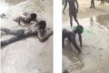 Viral Video Of Suspected Generator Thieves Being Forced To Roll In Dirty Water On Lagos Street 