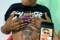 Young Woman Tattoos Popular Singer, Mayokun