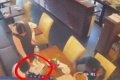 Nigerian Man Shares CCTV Footage Showing Moment Woman Stole His Friend's Phone In A UK Restaurant